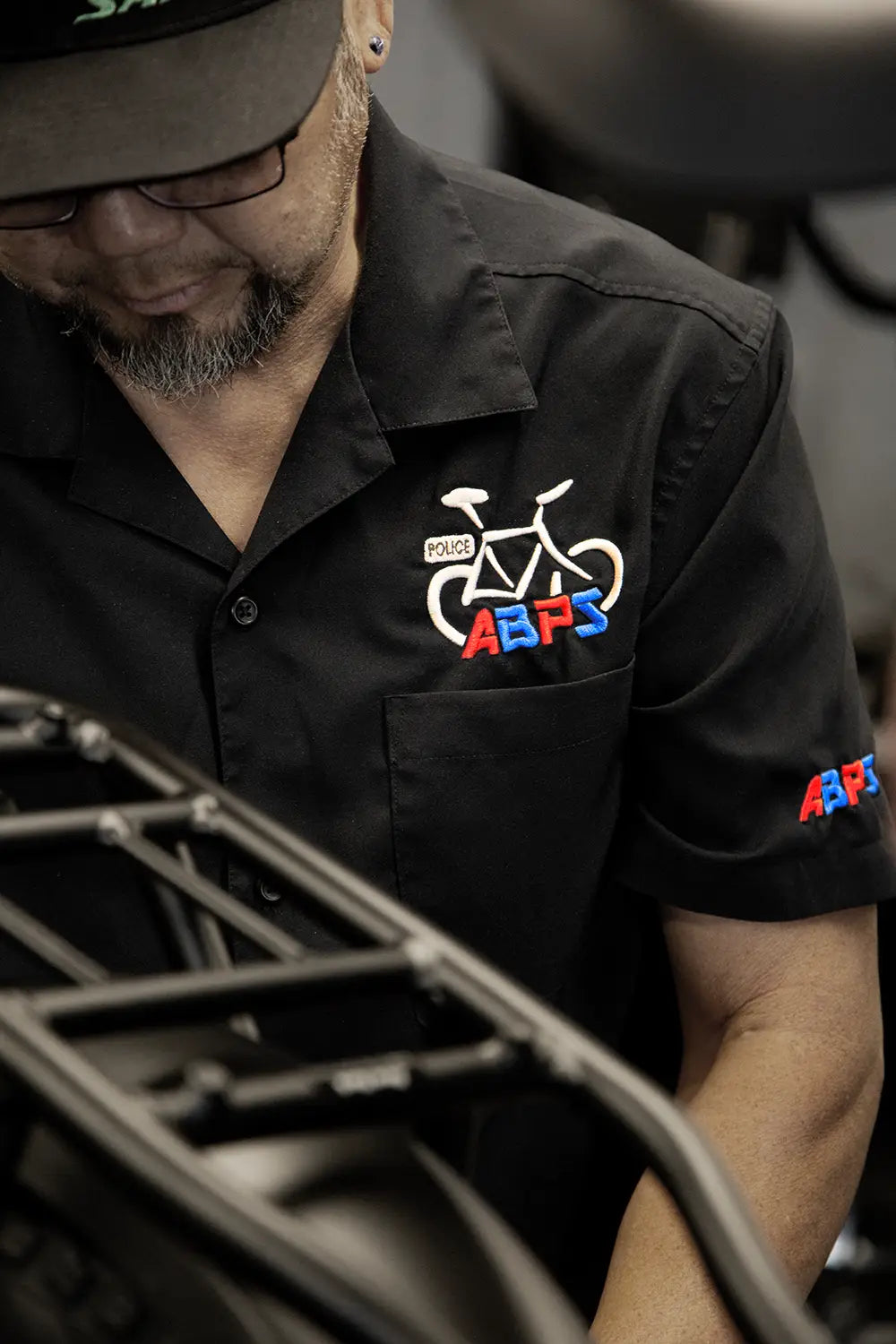 In shop bike mechanic doing a tune-up on an ebike.