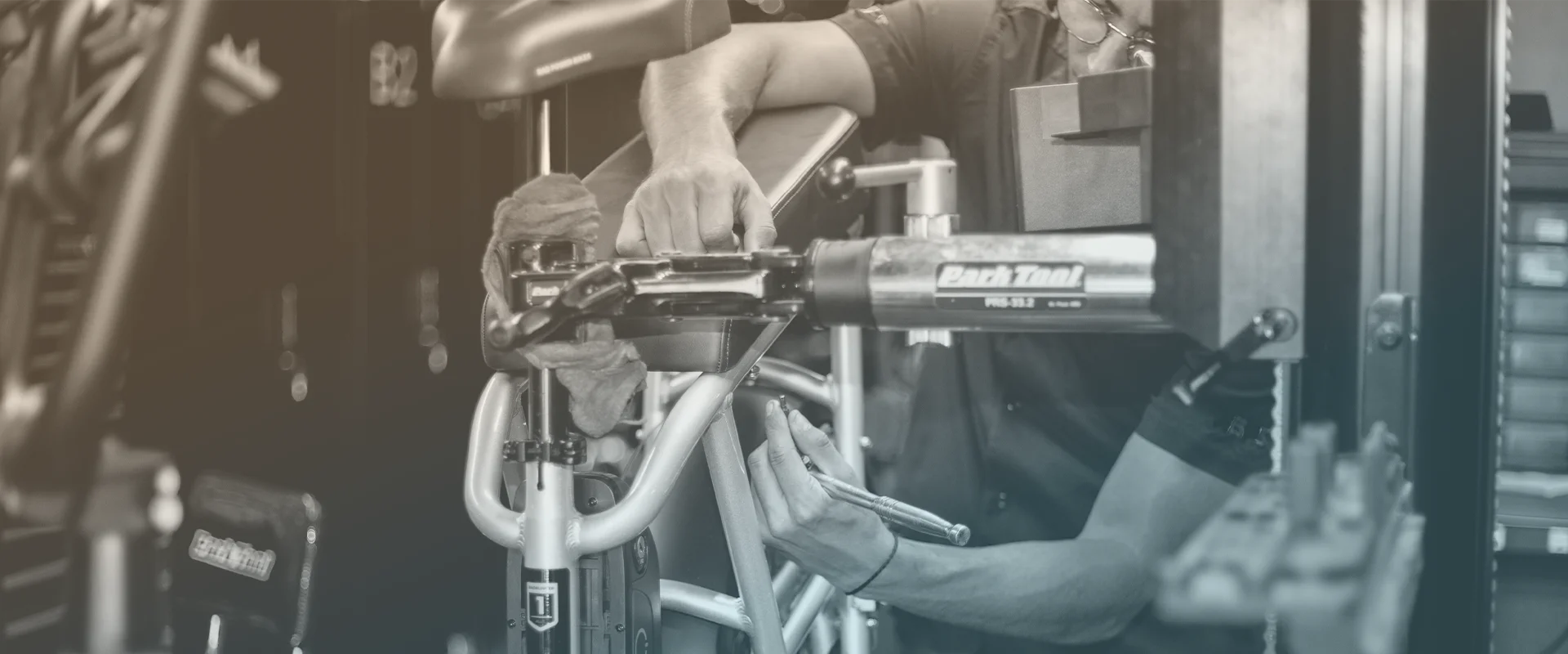 Bike mechanic assembling a RAD ebike at Mobile Bike Pros in-store shop.